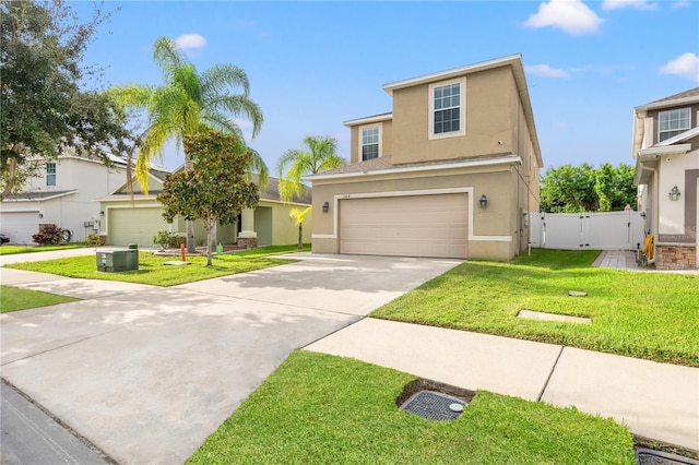 view of front of house with a garage and a front lawn