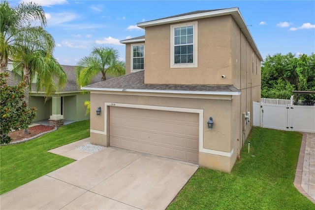 view of front of home with a garage and a front lawn