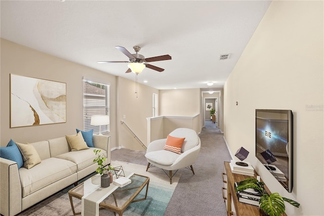 living room with carpet flooring and ceiling fan