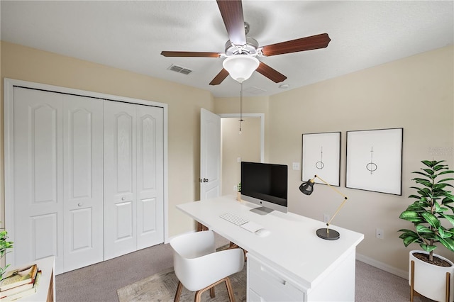 office space with carpet flooring and ceiling fan