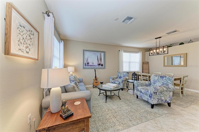 living room featuring an inviting chandelier