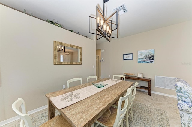 dining space with an inviting chandelier