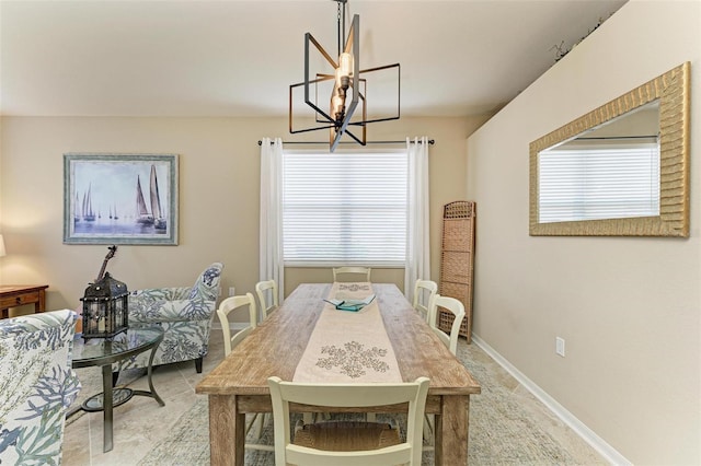 dining space featuring a chandelier