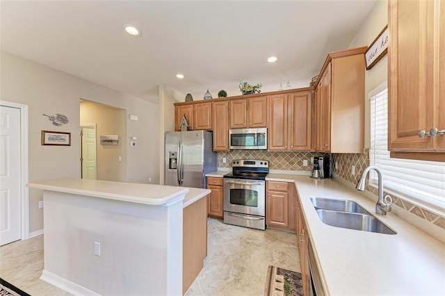 kitchen featuring light tile patterned flooring, sink, appliances with stainless steel finishes, tasteful backsplash, and a kitchen island