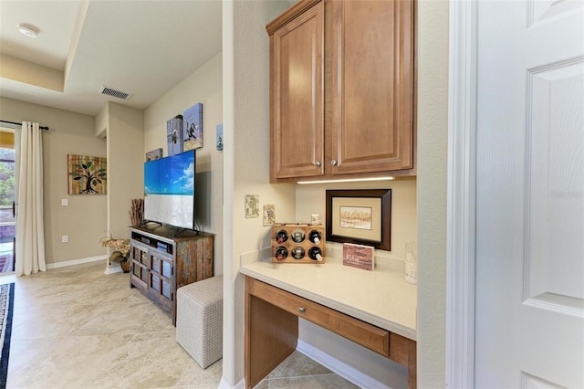 kitchen with light tile patterned flooring