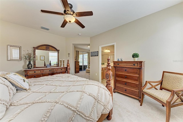 carpeted bedroom featuring ensuite bath and ceiling fan