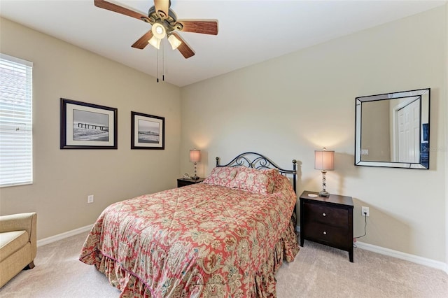 bedroom with light colored carpet and ceiling fan