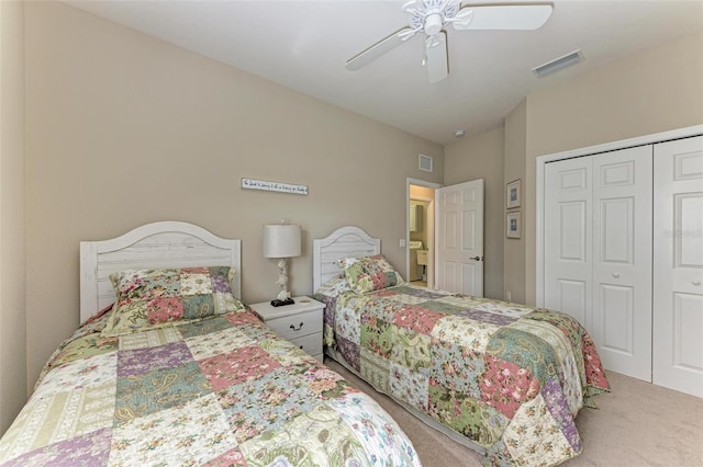 carpeted bedroom featuring ceiling fan and a closet