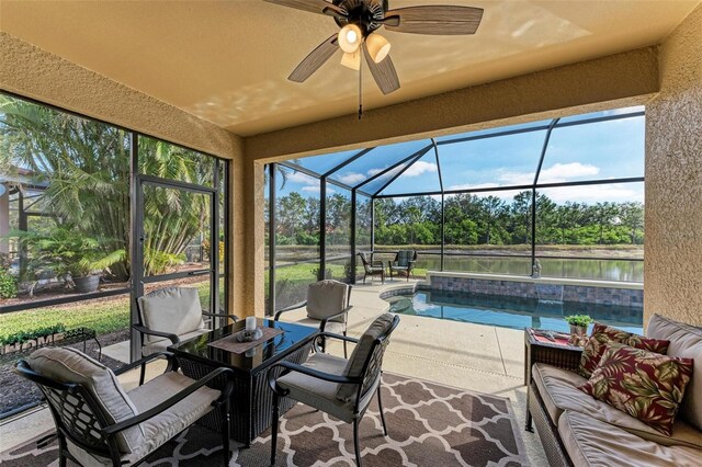 exterior space featuring a water view, ceiling fan, and a swimming pool