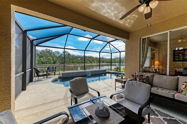 view of patio / terrace with ceiling fan, a pool with hot tub, a lanai, an outdoor living space, and a water view