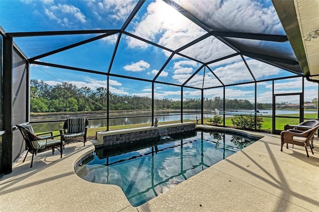 view of pool with a lanai, a water view, and a patio