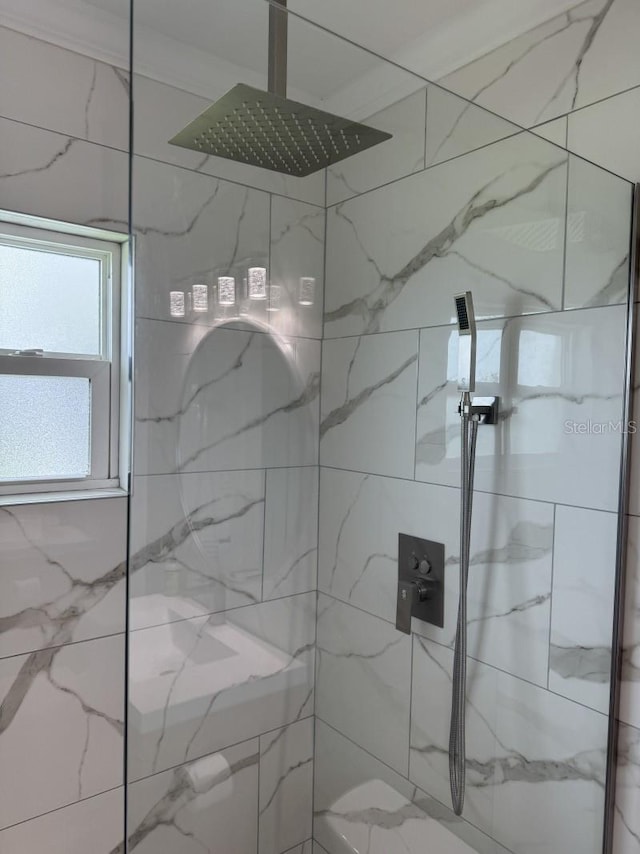 bathroom with tiled shower