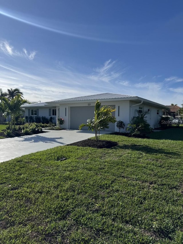 ranch-style house with a garage and a front lawn