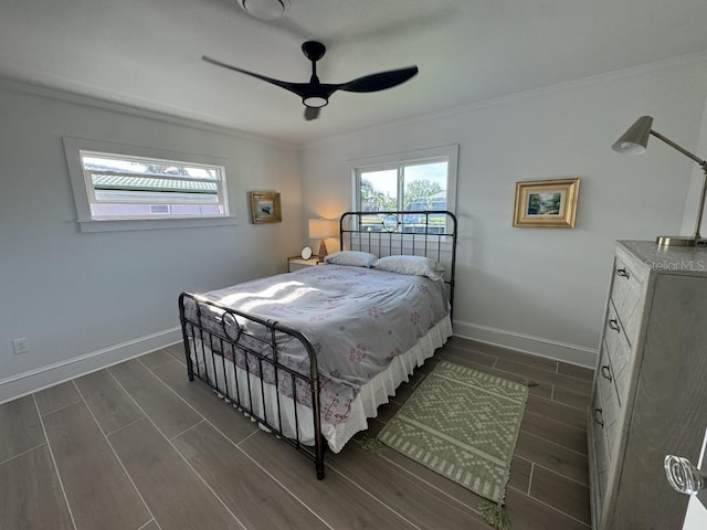 bedroom featuring ceiling fan and crown molding