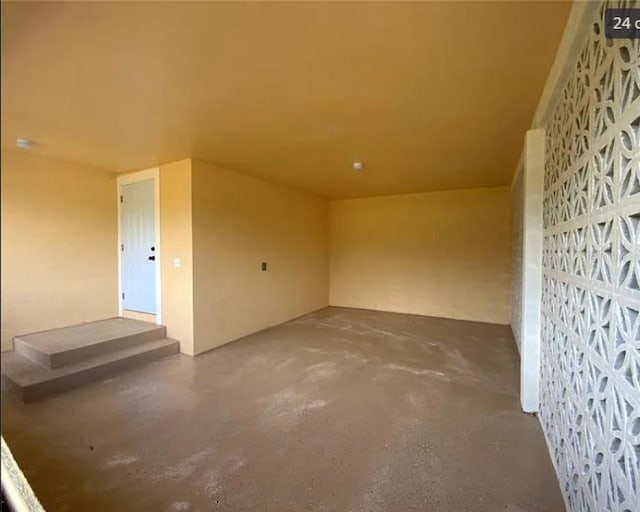 empty room with concrete flooring