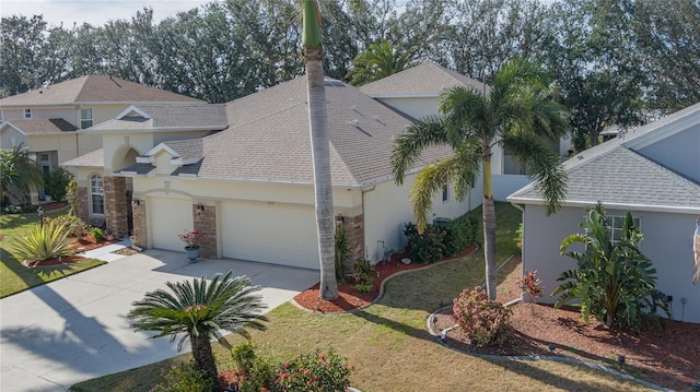 view of front of house featuring a front lawn and a garage