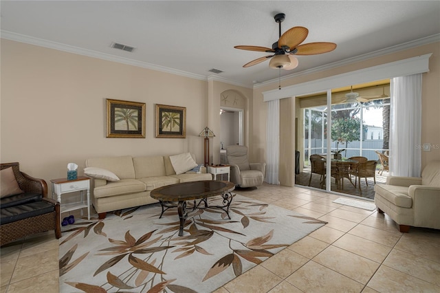 tiled living room featuring ceiling fan and crown molding