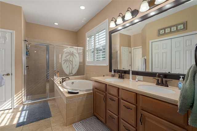 bathroom featuring separate shower and tub, tile patterned flooring, and vanity