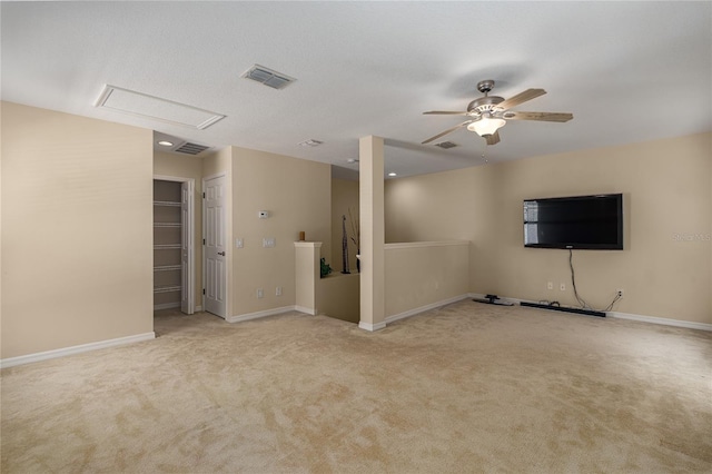 unfurnished living room with ceiling fan and light carpet