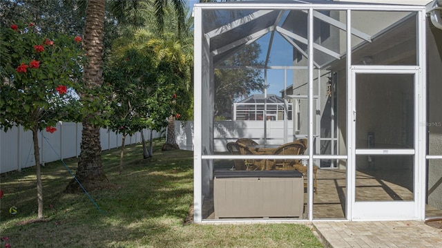 view of yard featuring glass enclosure