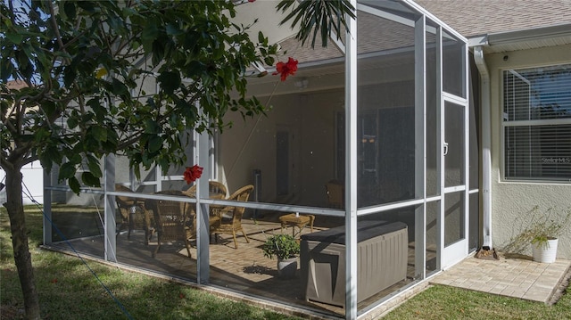 view of home's exterior with a patio, a lanai, and central air condition unit