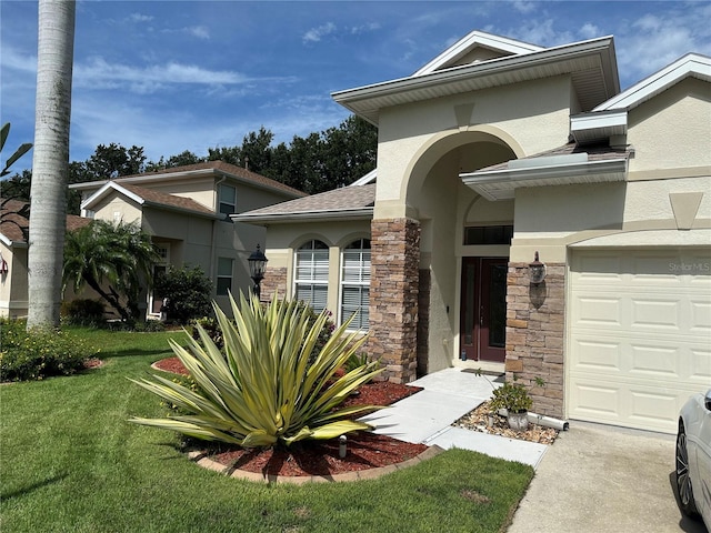 3439 101st Ave E, Parrish, FL 34219 - view of front facade featuring stucco siding, a front lawn, and stone siding