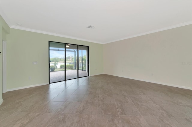 empty room featuring ornamental molding and light tile patterned floors