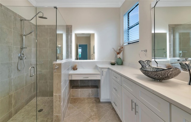 bathroom with crown molding, an enclosed shower, tile patterned floors, and vanity