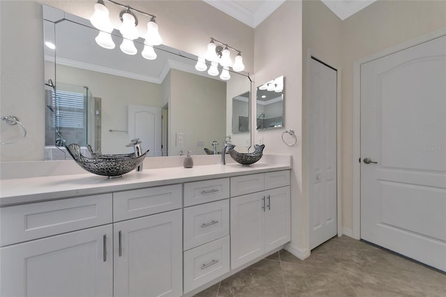 bathroom featuring crown molding and vanity