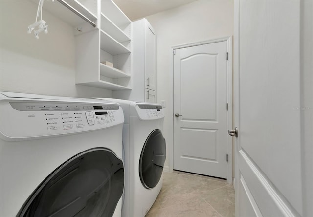 clothes washing area featuring washing machine and dryer and light tile patterned flooring