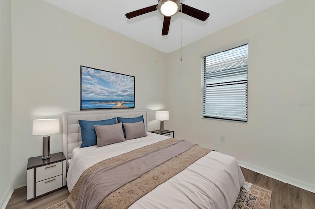 bedroom featuring ceiling fan and hardwood / wood-style flooring