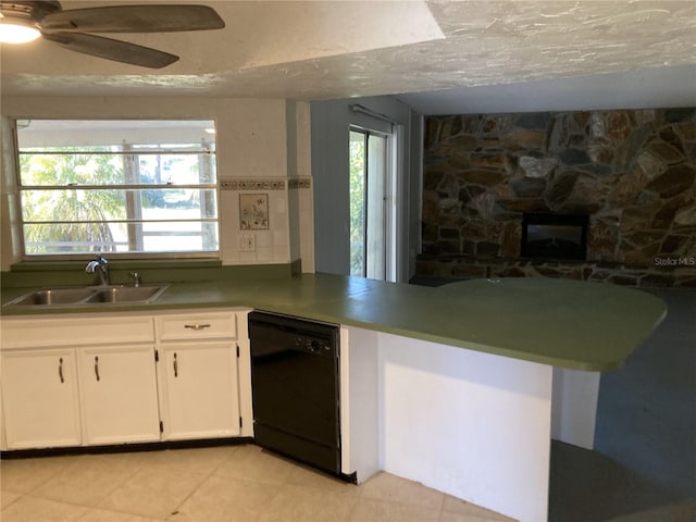 kitchen with white cabinetry, dishwasher, ceiling fan, sink, and a textured ceiling