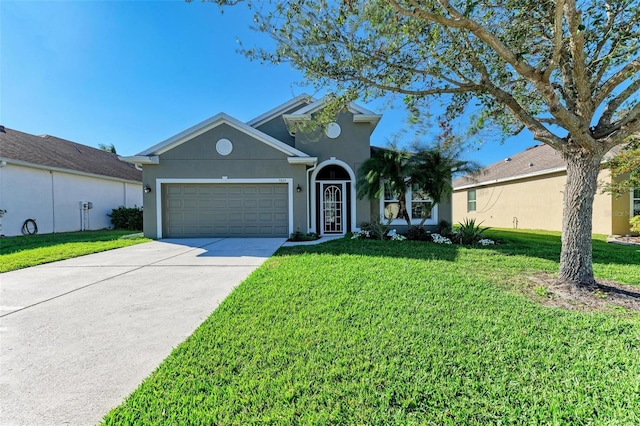 ranch-style home with a front yard and a garage