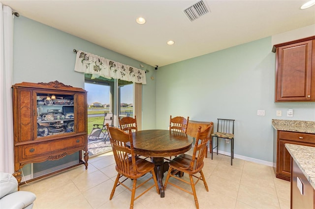 dining area featuring light tile patterned flooring