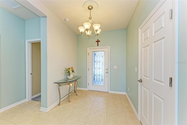 entryway with light tile patterned floors and an inviting chandelier