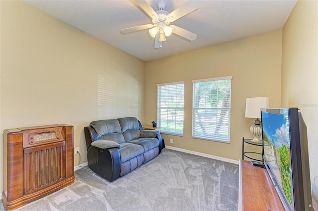 sitting room featuring carpet flooring and ceiling fan