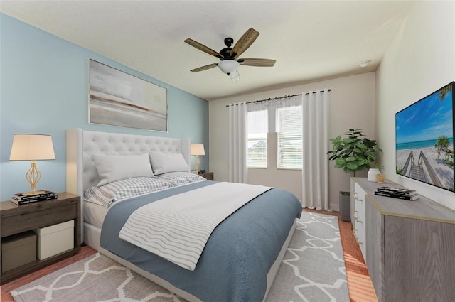 bedroom featuring ceiling fan and light hardwood / wood-style floors