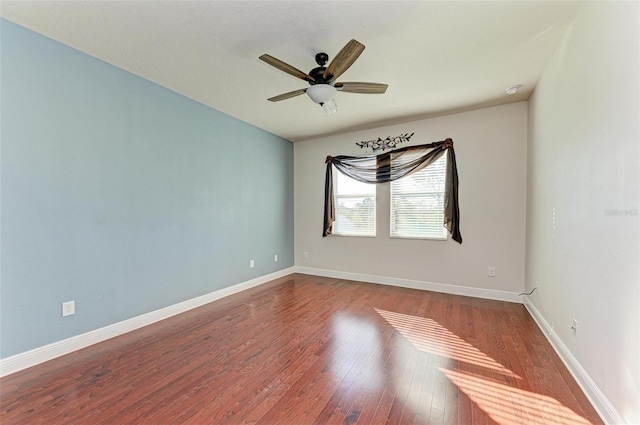 unfurnished room featuring hardwood / wood-style flooring and ceiling fan