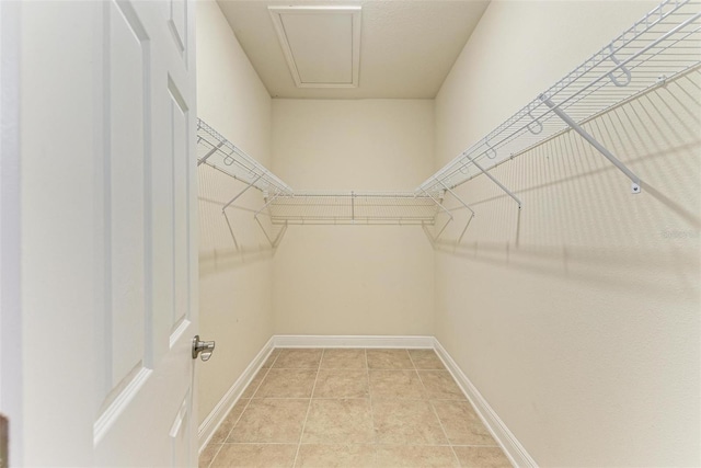 walk in closet featuring light tile patterned floors