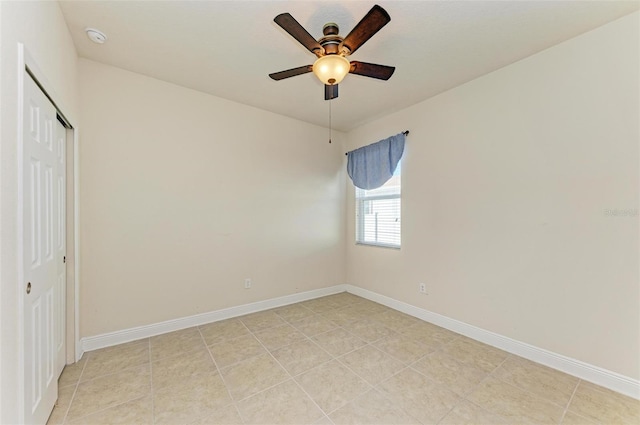 unfurnished bedroom with light tile patterned floors, a closet, and ceiling fan