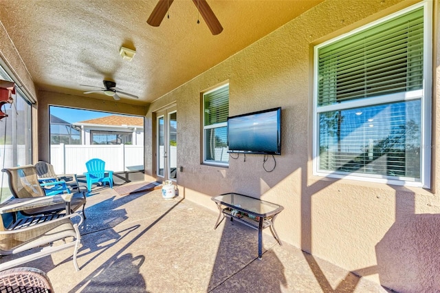 view of patio featuring ceiling fan