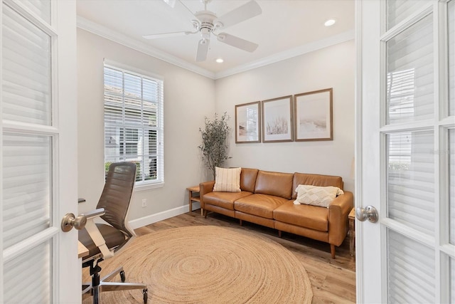 office with ceiling fan, french doors, light wood-type flooring, and ornamental molding