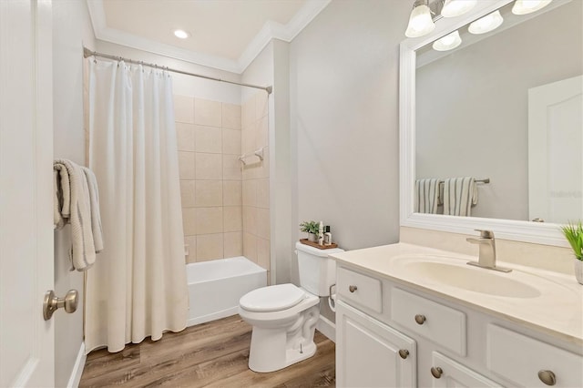 full bathroom featuring hardwood / wood-style floors, vanity, toilet, ornamental molding, and shower / tub combo