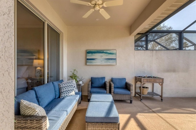 view of patio / terrace with outdoor lounge area, ceiling fan, and glass enclosure