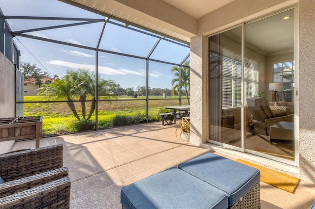 sunroom / solarium featuring a healthy amount of sunlight