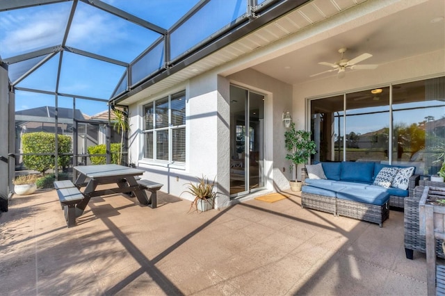 view of patio / terrace featuring an outdoor hangout area, ceiling fan, and a lanai