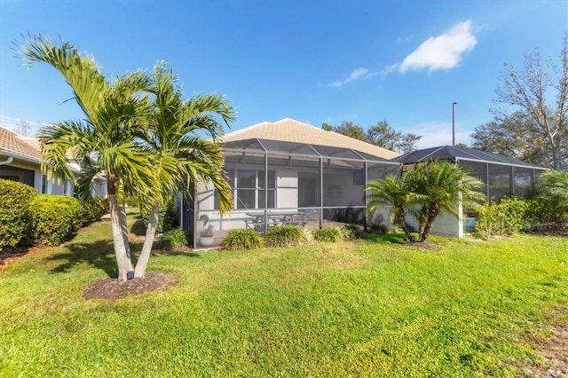 exterior space with a lanai and a front yard