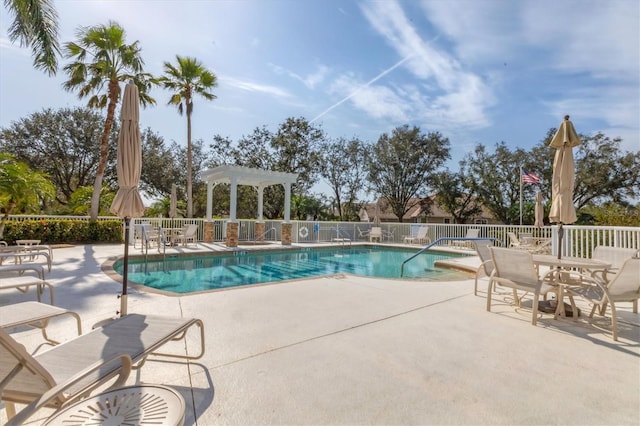 view of pool featuring a patio area and a pergola