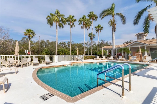 view of swimming pool with a patio