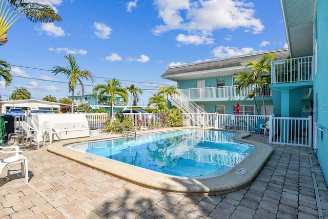 view of swimming pool featuring a patio